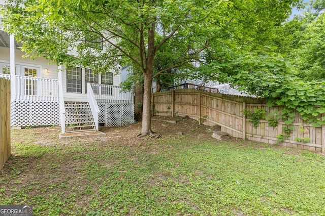 view of yard featuring a wooden deck