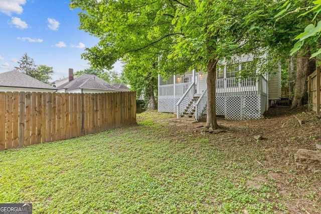 view of yard featuring a wooden deck