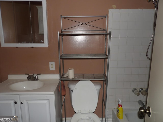 full bathroom featuring vanity, toilet, and tiled shower / bath combo