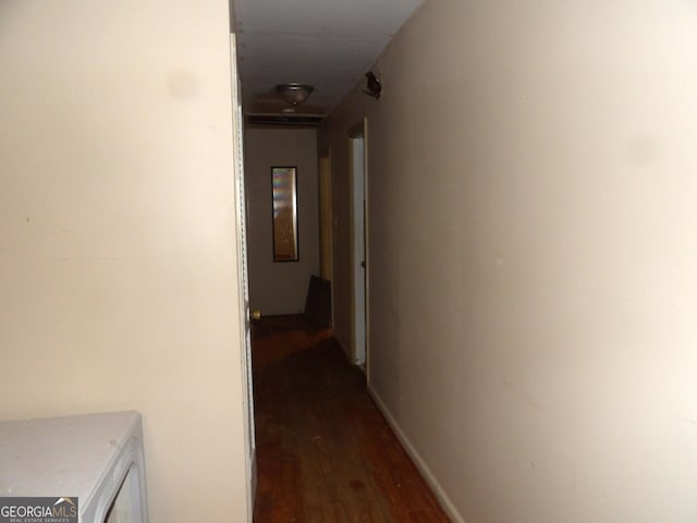 hall with dark wood-type flooring