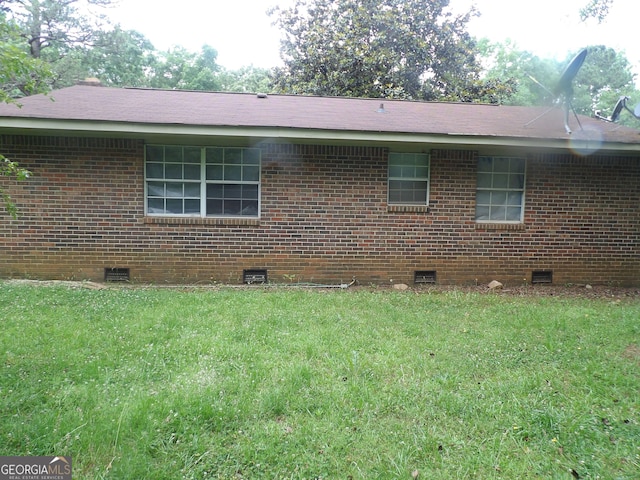 view of property exterior featuring a lawn