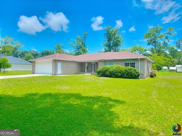 ranch-style home with a front yard, concrete driveway, brick siding, and an attached garage