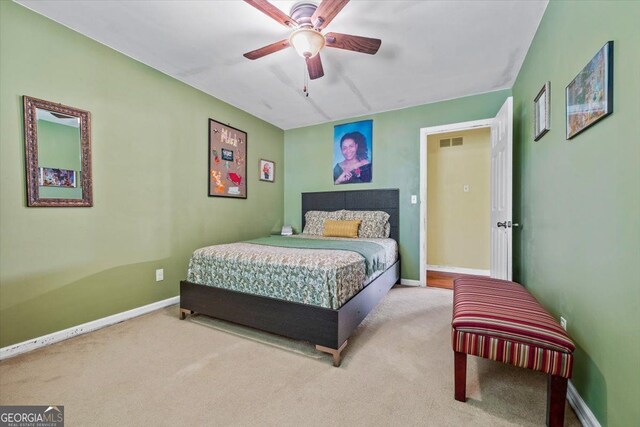 bedroom with ceiling fan and carpet flooring