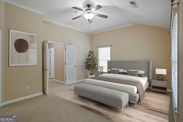 carpeted bedroom featuring ceiling fan, lofted ceiling, and ornamental molding