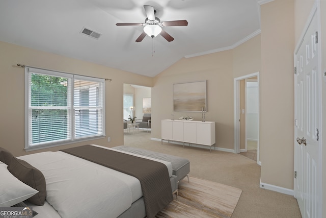 carpeted bedroom featuring lofted ceiling and ceiling fan