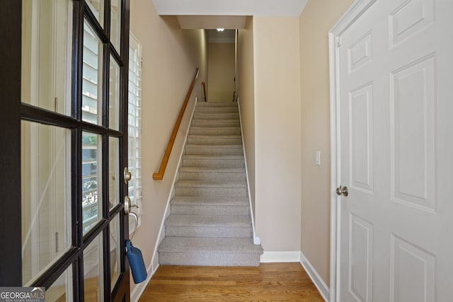 staircase featuring hardwood / wood-style flooring