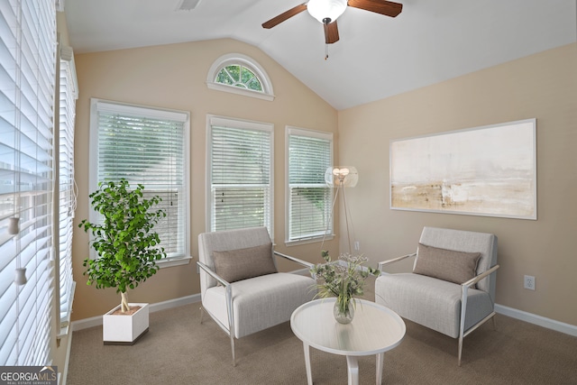 sitting room featuring carpet, vaulted ceiling, and ceiling fan