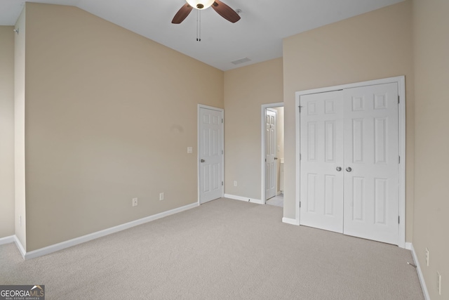 unfurnished bedroom with ceiling fan and carpet