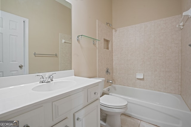 full bathroom with toilet, tile patterned floors, vanity, and tiled shower / bath