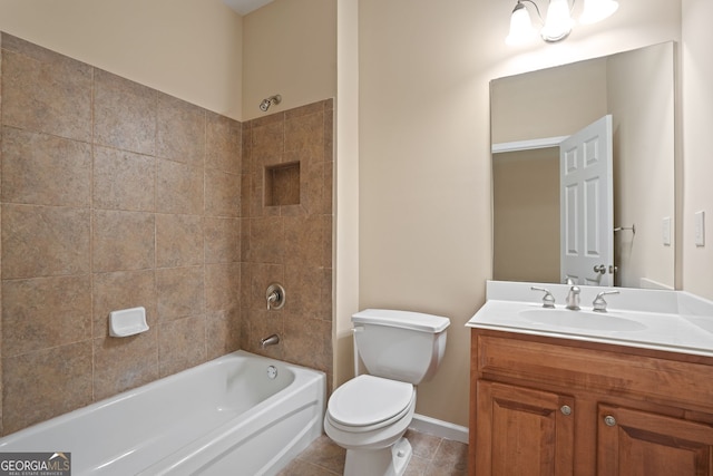 full bathroom with tiled shower / bath combo, vanity, tile patterned flooring, and toilet