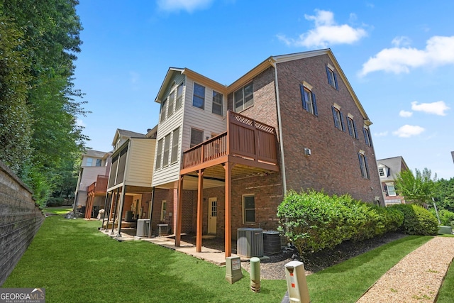 back of house with a patio, central AC unit, and a yard