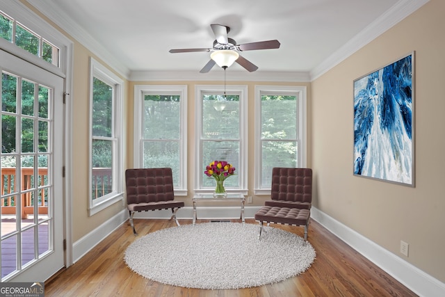 interior space with ceiling fan