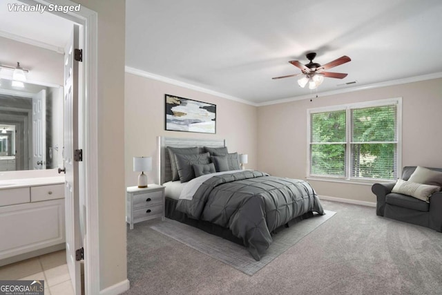 bedroom with ensuite bath, ceiling fan, ornamental molding, and light colored carpet