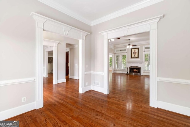 interior space with crown molding and dark hardwood / wood-style flooring