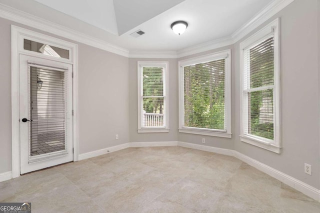 tiled spare room featuring ornamental molding