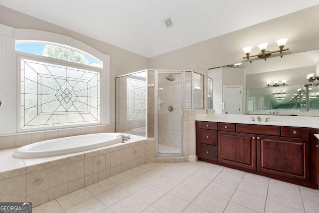 bathroom featuring vanity, tile patterned floors, and shower with separate bathtub