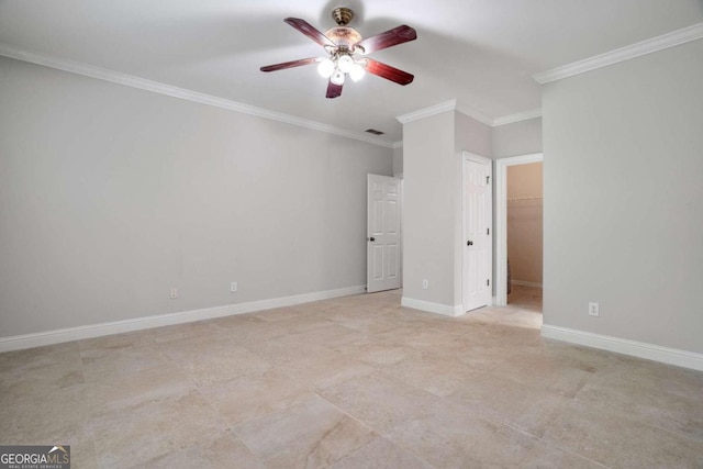 unfurnished bedroom with a spacious closet, a closet, crown molding, light tile patterned flooring, and ceiling fan