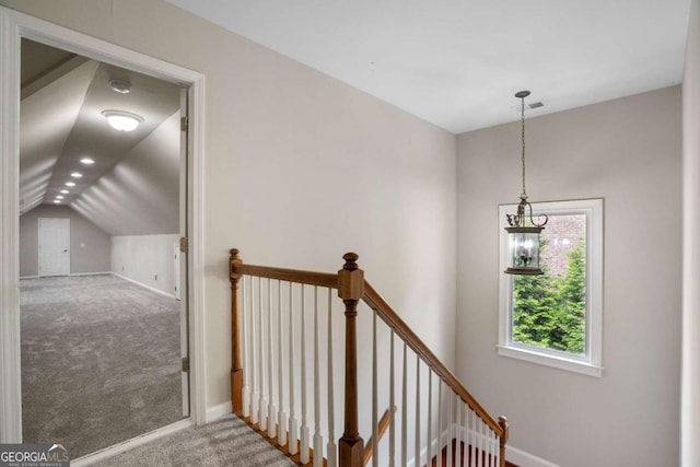 interior space featuring carpet floors and lofted ceiling