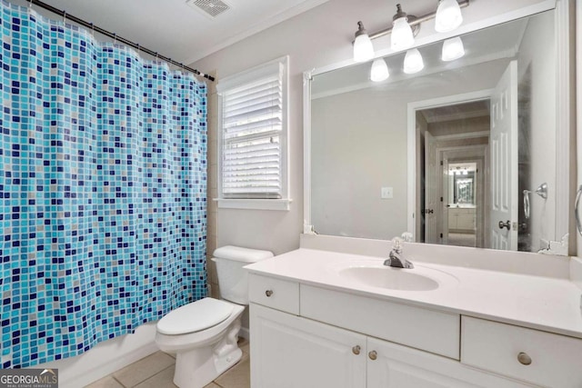 bathroom with tile patterned floors, toilet, vanity, and ornamental molding