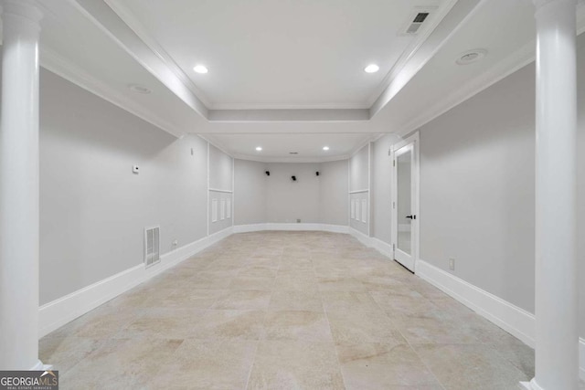 basement featuring light tile patterned floors and ornamental molding