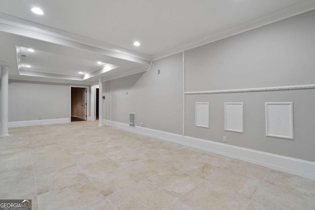 basement with light tile patterned floors and crown molding