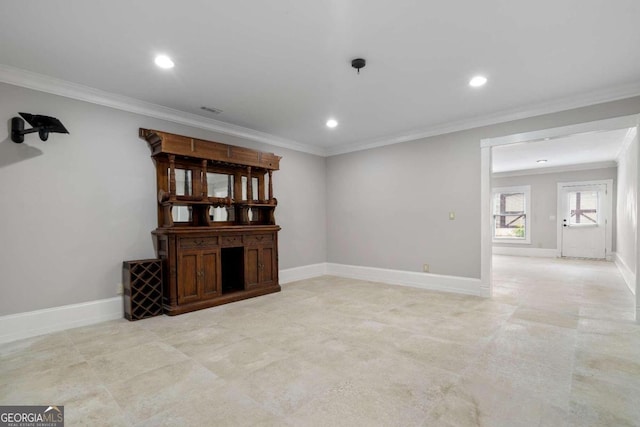 tiled spare room with crown molding