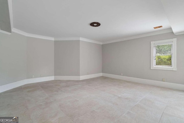 unfurnished room featuring light tile patterned floors and ornamental molding