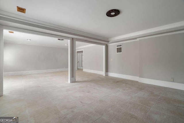 basement with light tile patterned floors and ornamental molding