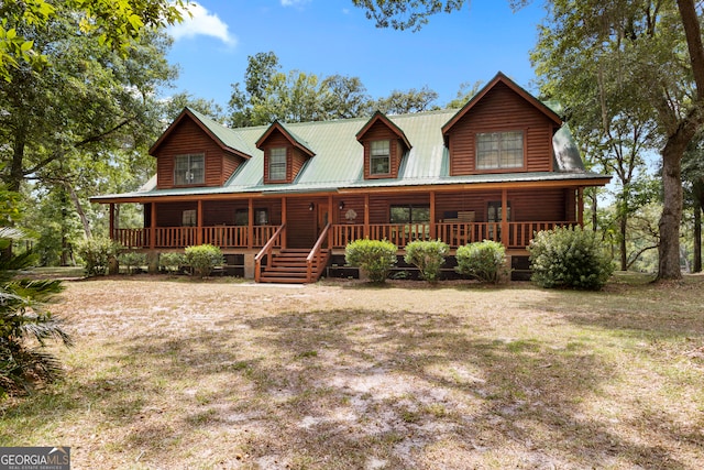 log-style house with a porch