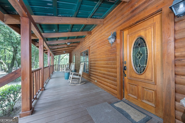 doorway to property featuring covered porch