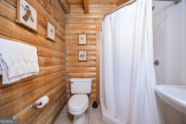 bathroom featuring log walls, walk in shower, toilet, sink, and tile patterned floors