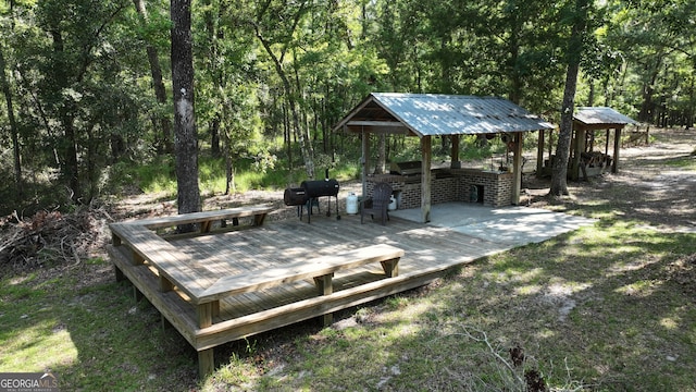 view of community with a wooden deck and a gazebo