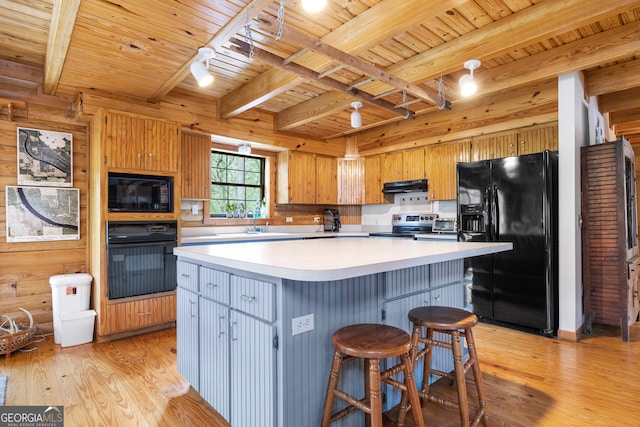 kitchen featuring wooden ceiling, black appliances, light hardwood / wood-style flooring, and a kitchen island