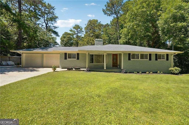 ranch-style home with a garage and a front lawn