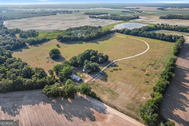 birds eye view of property with a rural view