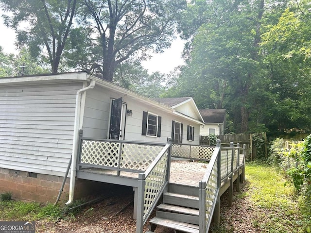 back of property featuring a deck