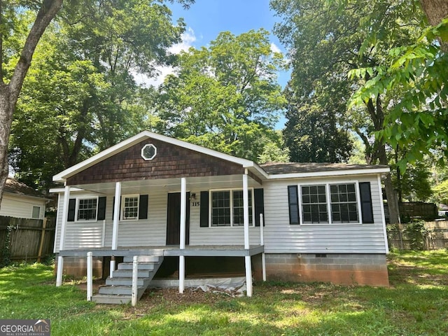 view of front of home with a front lawn and covered porch