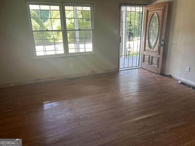 entrance foyer with dark hardwood / wood-style flooring