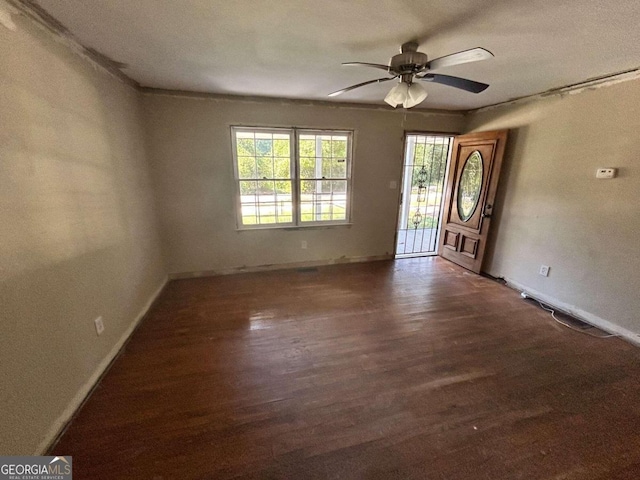 entrance foyer with dark wood-type flooring and ceiling fan