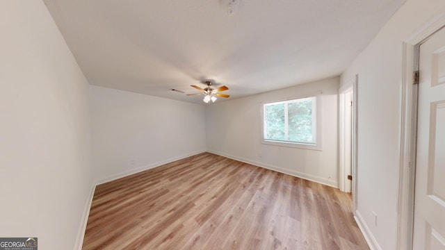 unfurnished room with light hardwood / wood-style flooring and ceiling fan