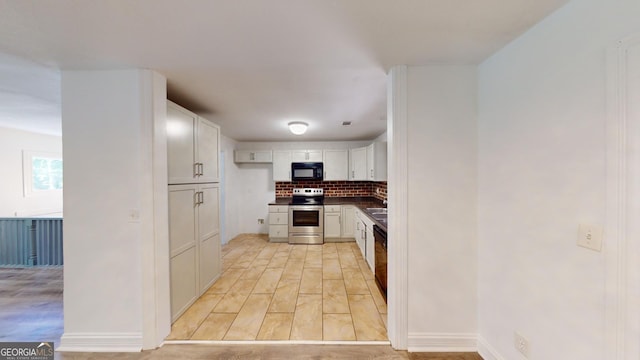 kitchen with white cabinetry, dishwashing machine, electric range, light hardwood / wood-style flooring, and backsplash