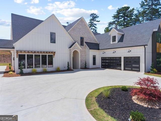 modern inspired farmhouse featuring a garage