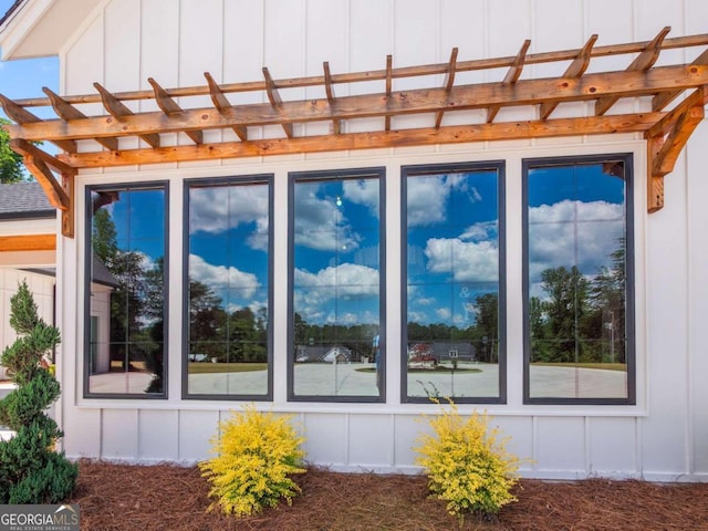 view of side of home featuring a pergola