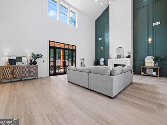 living room with a towering ceiling