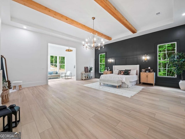 bedroom featuring a notable chandelier and beam ceiling