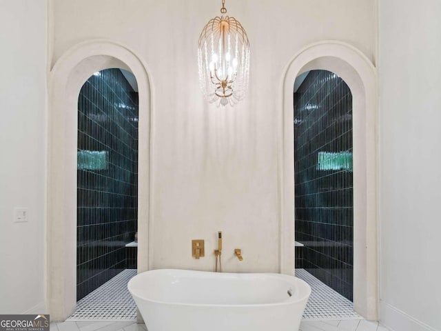 bathroom featuring separate shower and tub, tile patterned flooring, and a chandelier