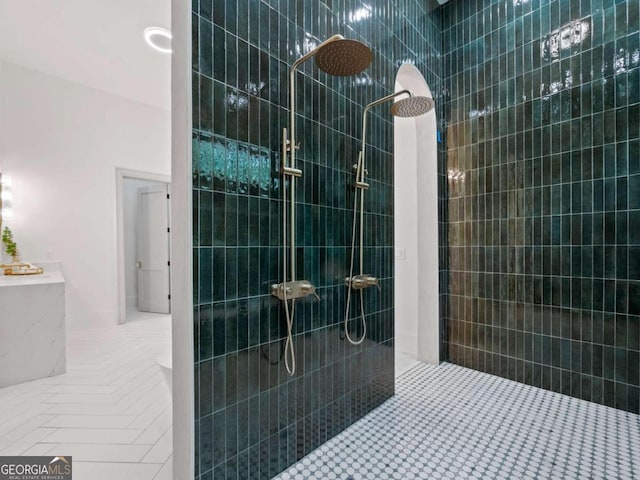 bathroom with tiled shower