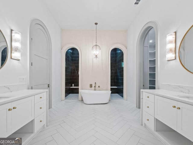 bathroom featuring vanity and a bathtub