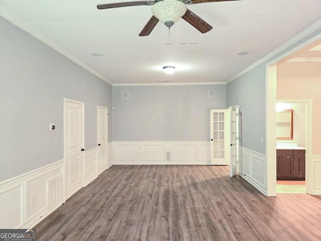 spare room with french doors, ceiling fan, crown molding, and hardwood / wood-style flooring