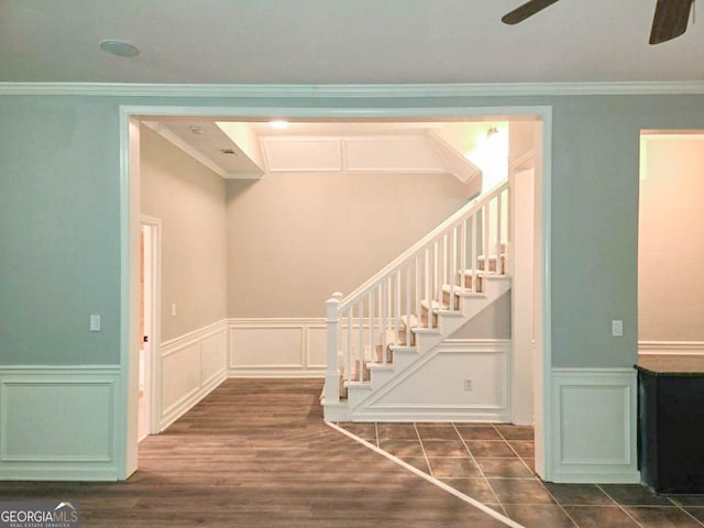 stairway featuring ceiling fan, crown molding, and tile patterned flooring